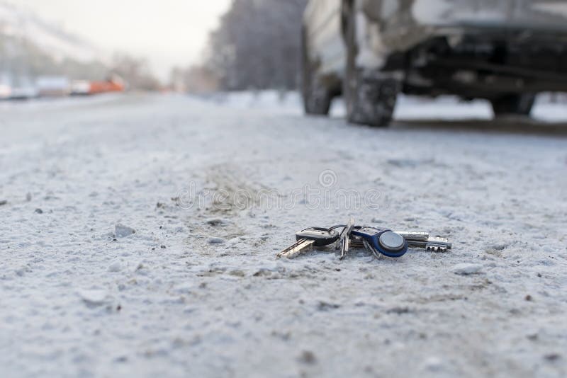 Lost a bunch of keys lying on the side of the road in the winter on the snow stock image
