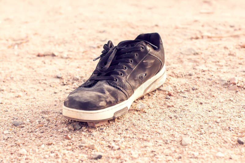 Lost Dirty Shoe on Ground in the Street. Poverty Concept Stock Photo ...