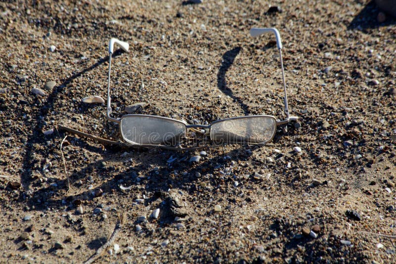 Lost glasses on beach stock photo. Image of sand, pond - 66850808