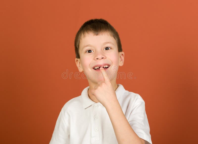 Lost tooth boy portrait on brown stock images Lost tooth boy portrait on brown stock images