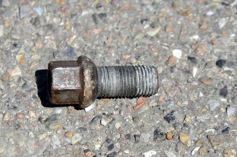 Lost Wheel Bolt from a Car on the Road Stock Photo Image of danger