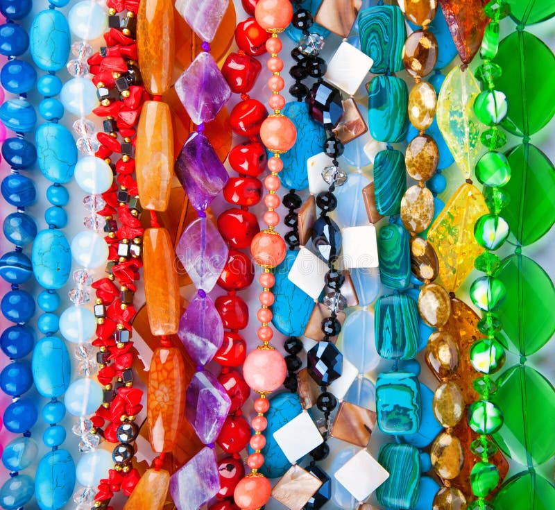 Lot Of Colored Beads From Different Minerals. Stone Background Stock
