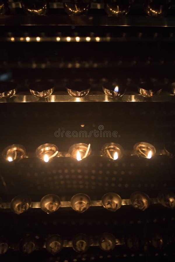 Candle flame close-up. Many Candles in a Buddhist temple. Religious Festival. Oil Lamp stock photography Candle flame close-up. Many Candles in a Buddhist temple. Religious Festival. Oil Lamp stock photography
