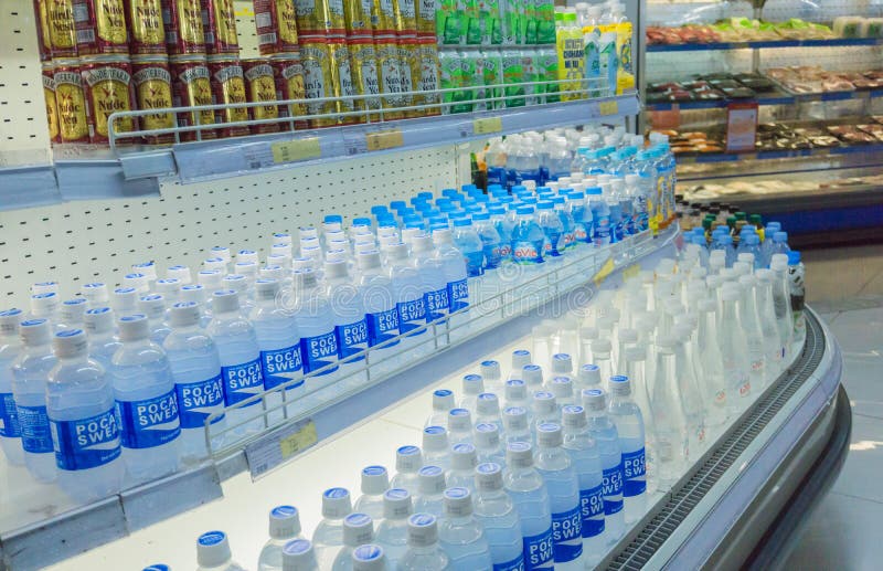 Close Up on Mineral Water Bottles in Lines at a Supermarket in Vietnam ...