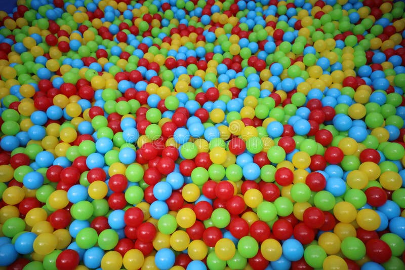 A lot of colorful small plastic balls in ball pool stock photos