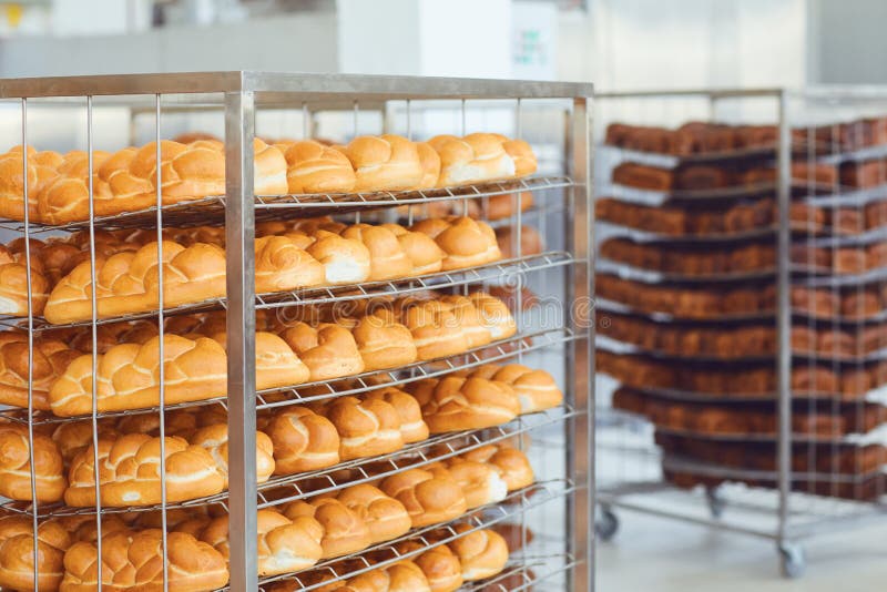 Lot with Fresh Brown Bread at the Bakery. Stock Photo Image of