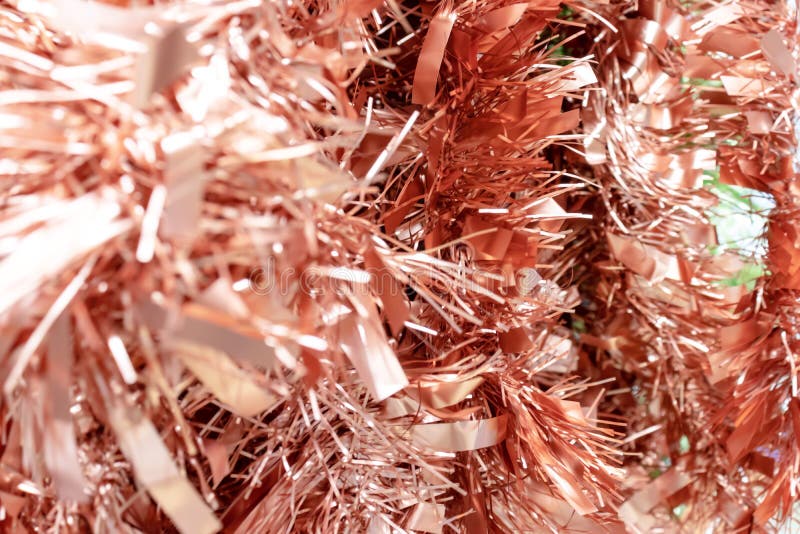 A lot of hanging orange decortive tinsel in a store stock image