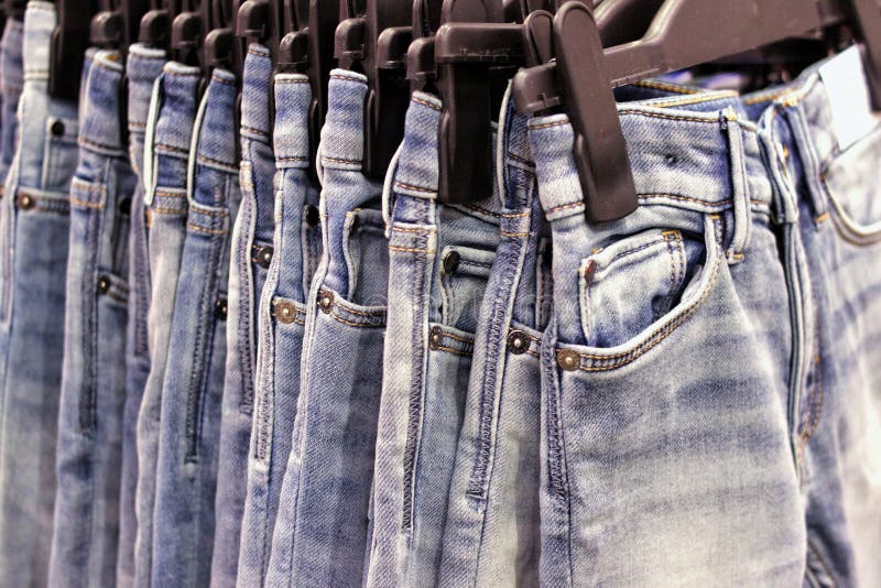 Jeans on hangers stock image. Image of style, silks, elegance - 20624259