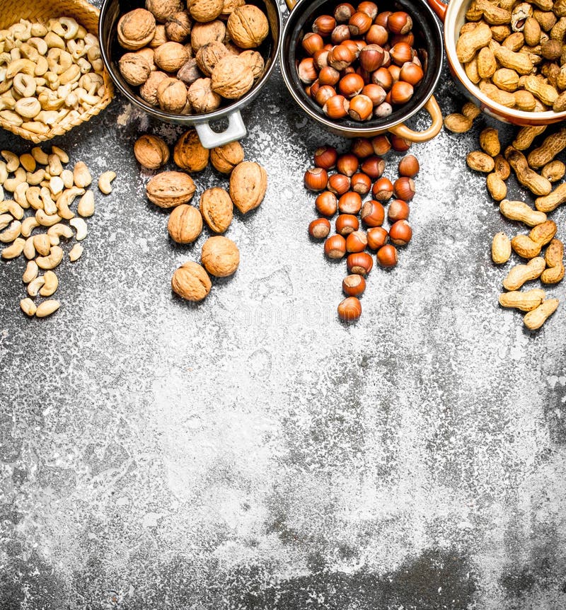 A Lot of Nuts in Different Bowls. Stock Photo Image of hazelnut