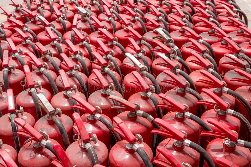 A lot of old fire extinguishers. stock images