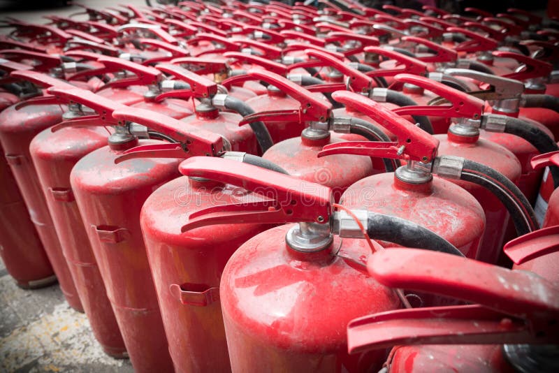 A lot of old fire extinguishers. royalty free stock photos