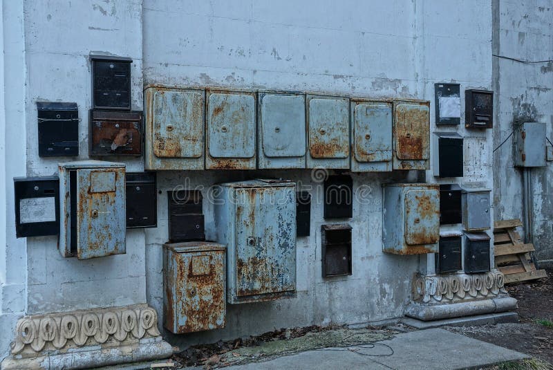A Lot of Old Gray and Black Iron Mailboxes in Rust Stock Image Image