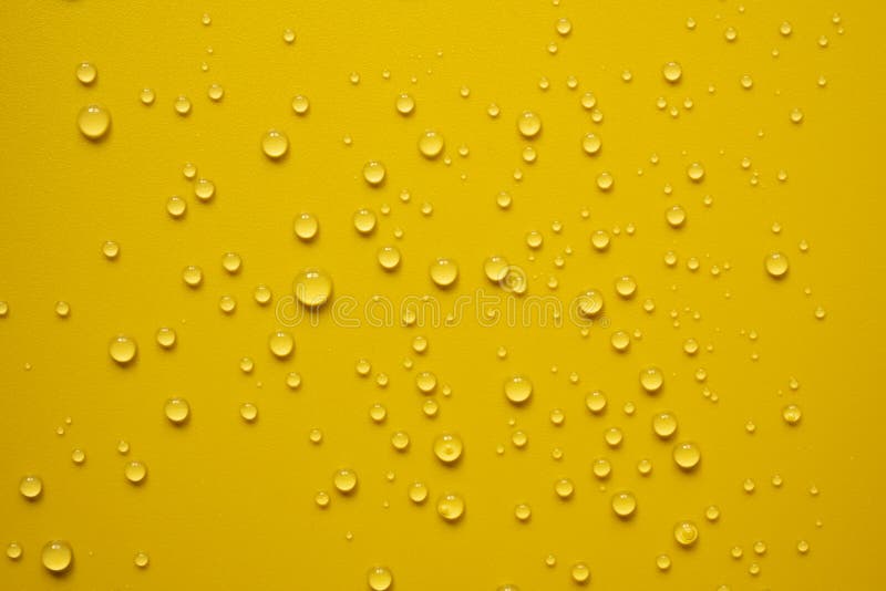 Lot of Small Drops on a Yellow Surface, Splashed Water. Abstract
