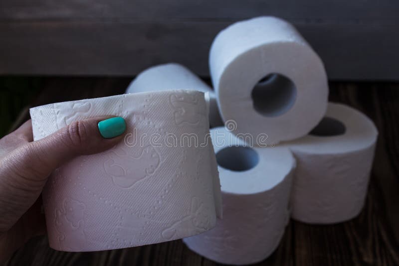 Lot of Toilet Paper and a Hand Stock Photo Image of care, hygiene