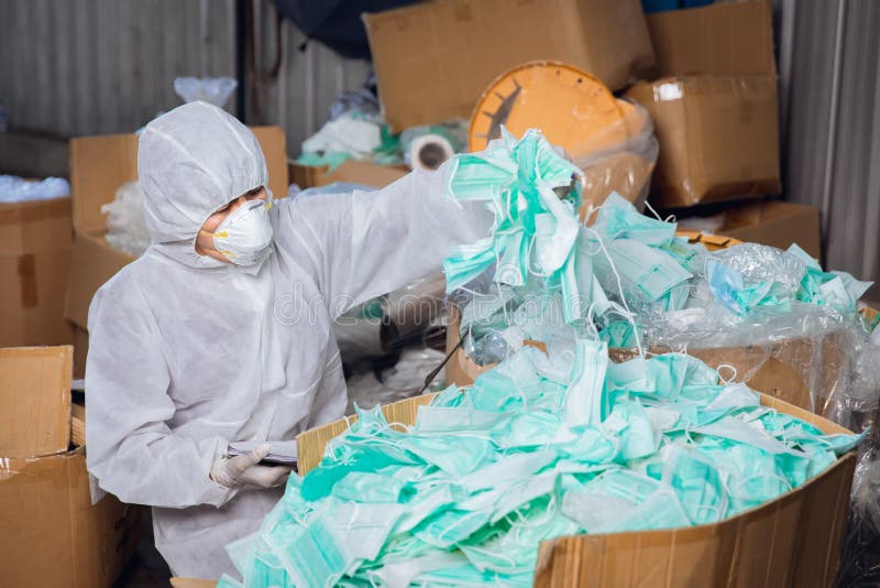 A lot of used face mask not well managed, biohazard garbage medical contaminate trash very dangerous stock image