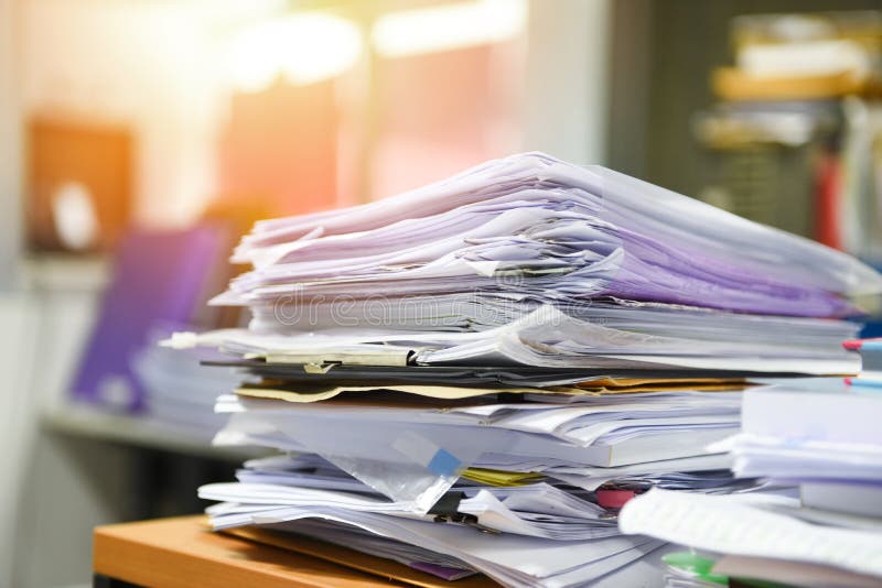 Lot of work document file working stacks of paper files searching information on work desk office - business report papers piles stock image