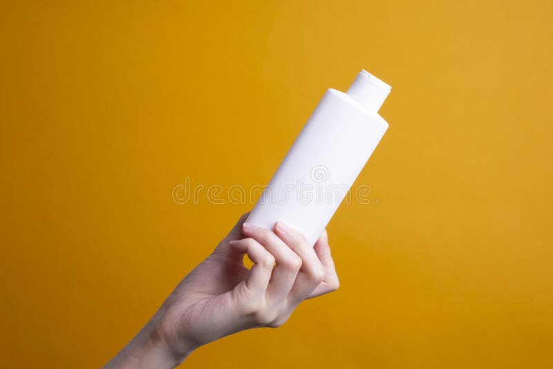 Packaging of Lotion or Hand Cream in Female Hands Stock Photo Image