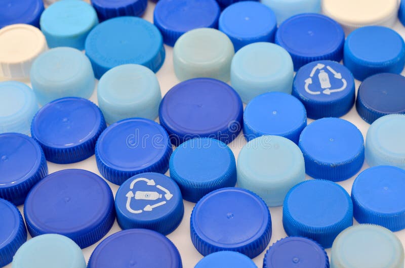 Lots of blue plastic lids for recycling stock image