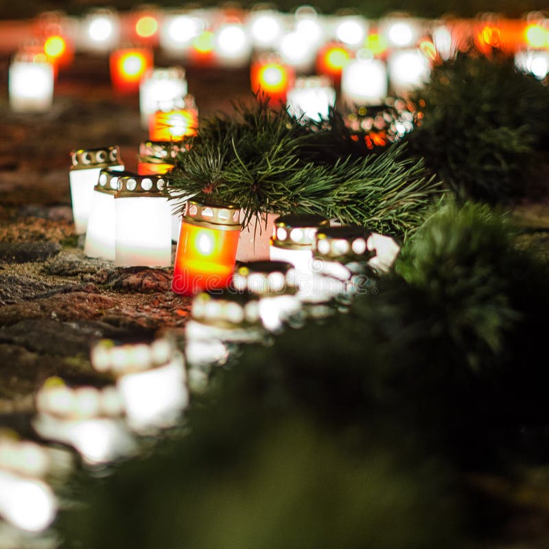 Lots of Burning Candles Arranged in Rows on the Pavement Stock Photo ...