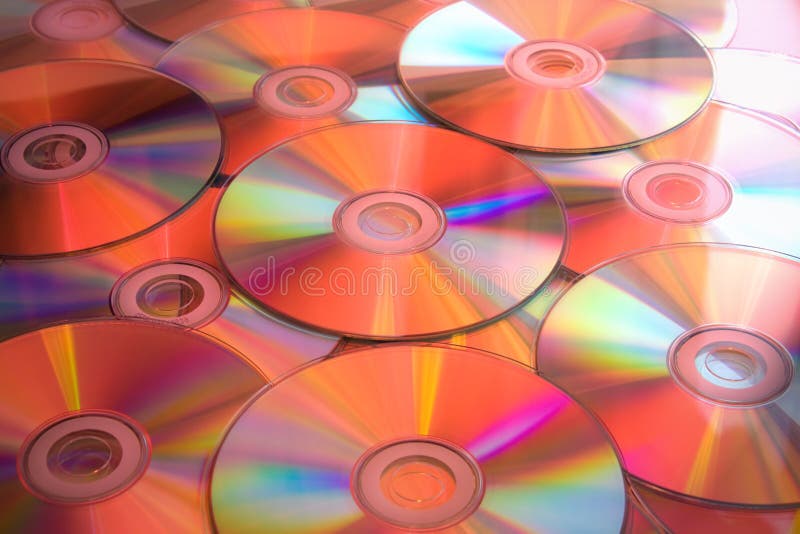 Lots of cd disks in red light.