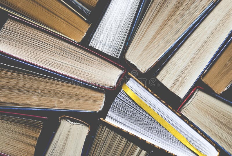 Lots of colourful thick open books stand on a dark background. ready to read royalty free stock photography Lots of colourful thick open books stand on a dark background. ready to read royalty free stock photography