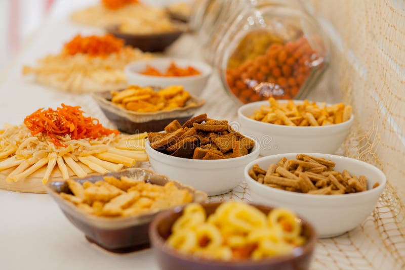 A Lots of Salty Snacks on a Table, Many Cheese and Crackers on the