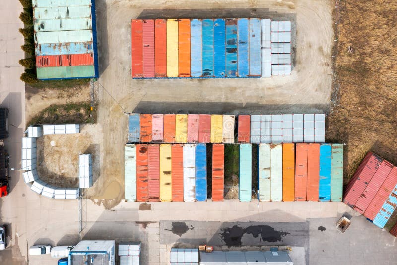 Lots of shipping containers, containers in a logistics warehouse, top view of a lot of colorful metal containers