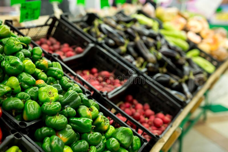 Lots of Vegetables in the Produce Aisle at a Supermarket. Stock Photo