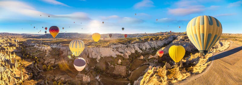 Hot air Balloons flight in Cappadocia, Nevsehir, Turkey in a beautiful summer day. Hot air Balloons flight in Cappadocia, Nevsehir, Turkey in a beautiful summer day