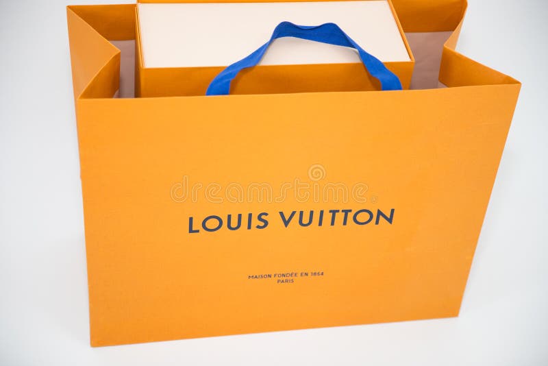 A Louis Vuitton Box near the Flowers · Free Stock Photo