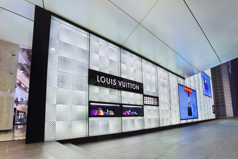 FILE--A Chinese employee looks on in a Louis Vuitton (LV) store in  Shanghai, China, 18 October 2012. More than half of all Louis Vuitton  purchases Stock Photo - Alamy