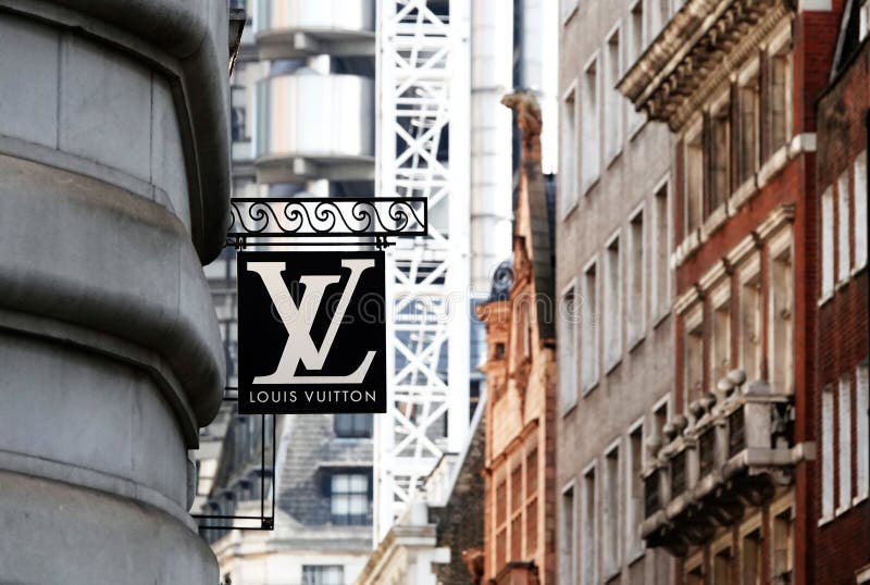 Street Signage Board with Louis Vuitton Logo in the Evening. Blurred  Business District Skyscrapers Background Editorial Image - Image of  evening, banner: 85967980