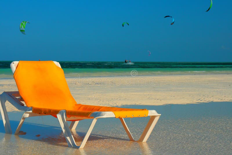 Lounge chair on beach stock image. Image of island, tourism 23708657
