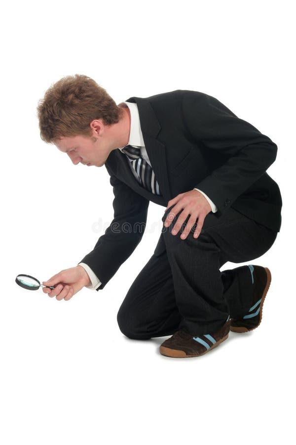 Loupe de fixation d'homme d'affaires photo stock