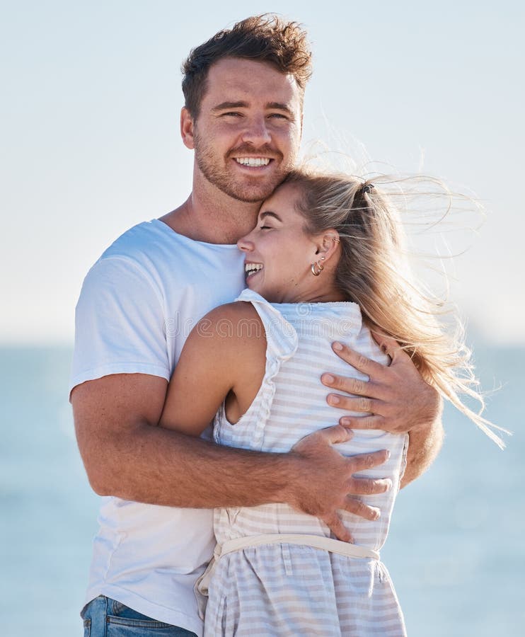 Love Beach Hug And Couple Smile On Romantic Ocean Holiday Trip Together For Relationship