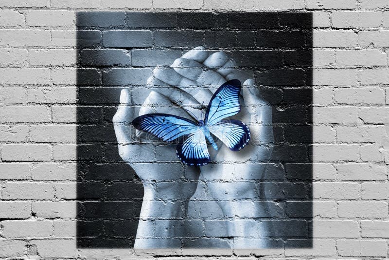 Graffiti Händen einen Schmetterling auf einer Mauer.