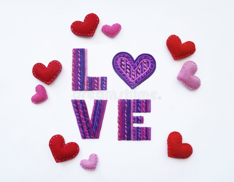 Love from clay. Plasticine letters the view from the top. Plasticine love. Valentine`s day. Heart out of felt.