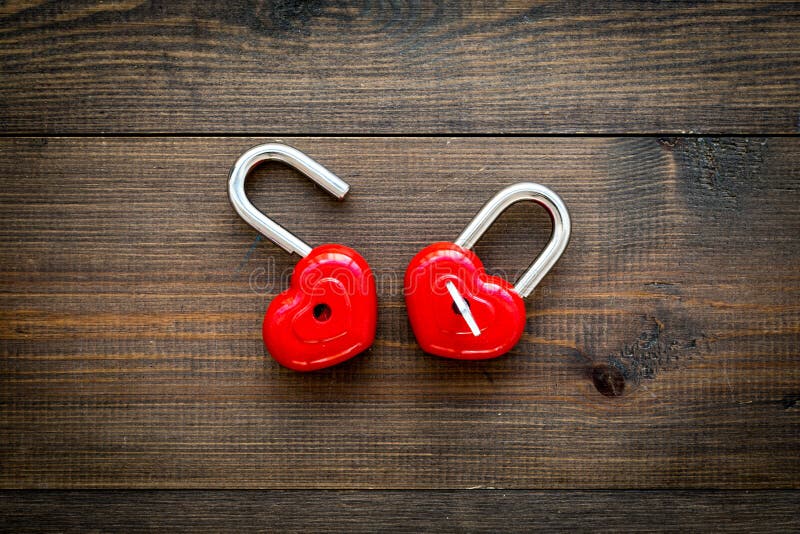 Love concept. Valentine`s day symbol. Locks in shape of heart o dark wooden background top view copy space royalty free stock images Love concept. Valentine`s day symbol. Locks in shape of heart o dark wooden background top view copy space royalty free stock images