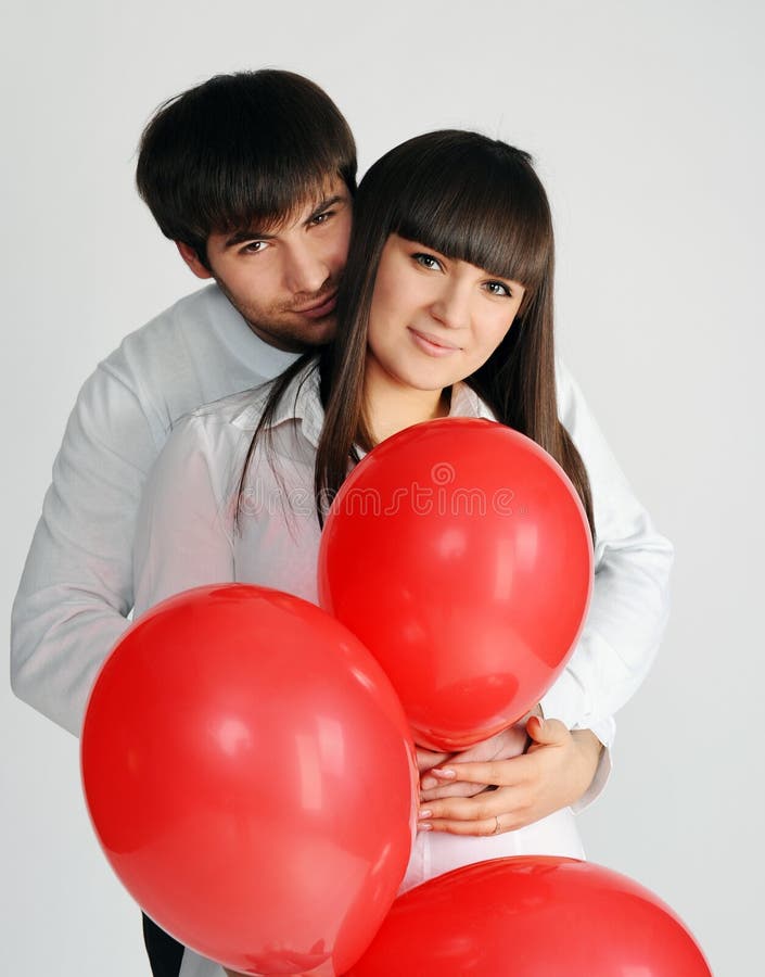 Love couple with red balloons
