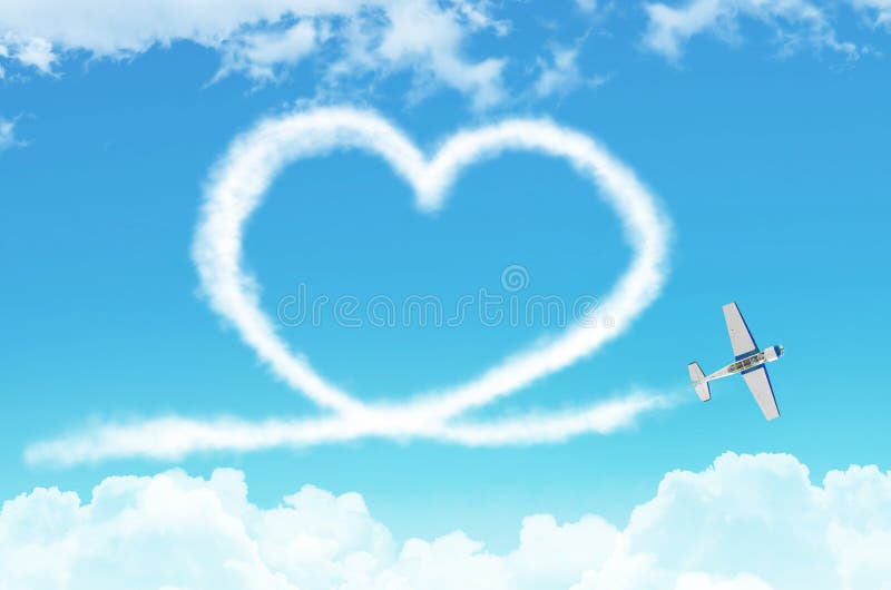 Love figurative heart from a white smoke trail light-engine airplane among the clouds. stock images Love figurative heart from a white smoke trail light-engine airplane among the clouds. stock images