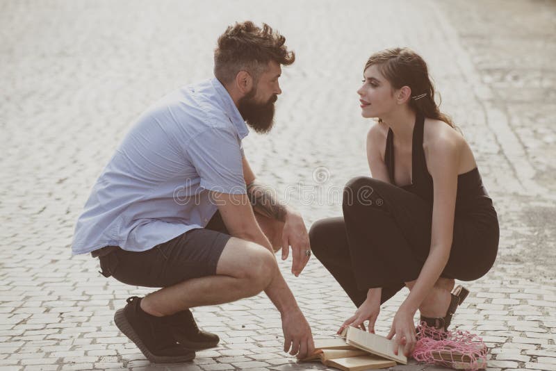 Love at first sight. Man and woman falling in love. Bearded man and cute woman met on street. Hipster helping and