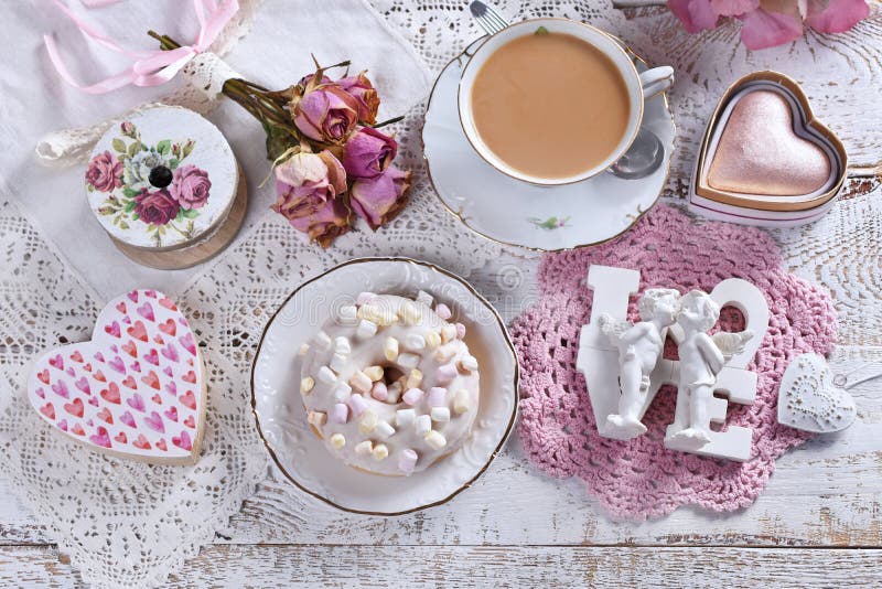 Love flat lay with a donut and a cup of coffee