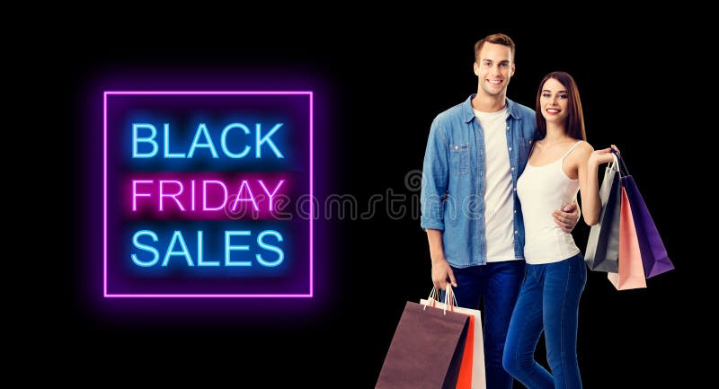 Love, holiday sales, shop, retail, consumer concept - happy couple with shopping bags. Isolated over dark background. Black friday sales neon light sign text. Love, holiday sales, shop, retail, consumer concept - happy couple with shopping bags. Isolated over dark background. Black friday sales neon light sign text
