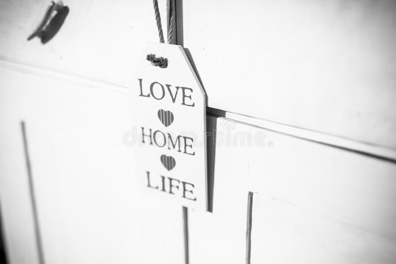 Love, home, life sign on wooden ornament and positive thinking wooden plaque stock image Love, home, life sign on wooden ornament and positive thinking wooden plaque stock image