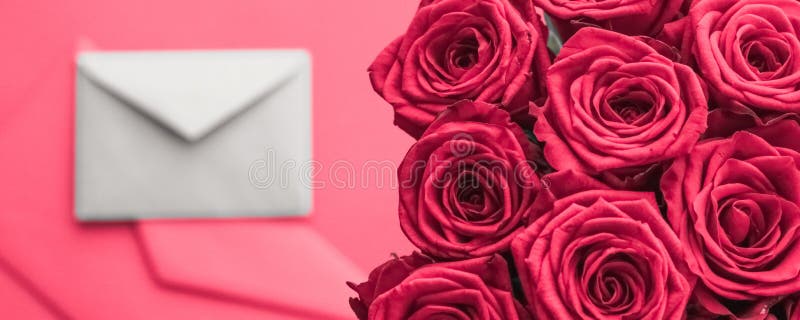 Love letter and flowers delivery on Valentines Day, luxury bouquet of roses and card on pink background for romantic holiday stock photos Love letter and flowers delivery on Valentines Day, luxury bouquet of roses and card on pink background for romantic holiday stock photos