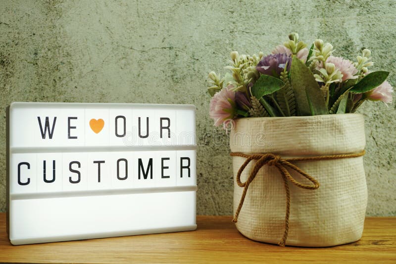 We love our customer word in light box business concept background royalty free stock photography