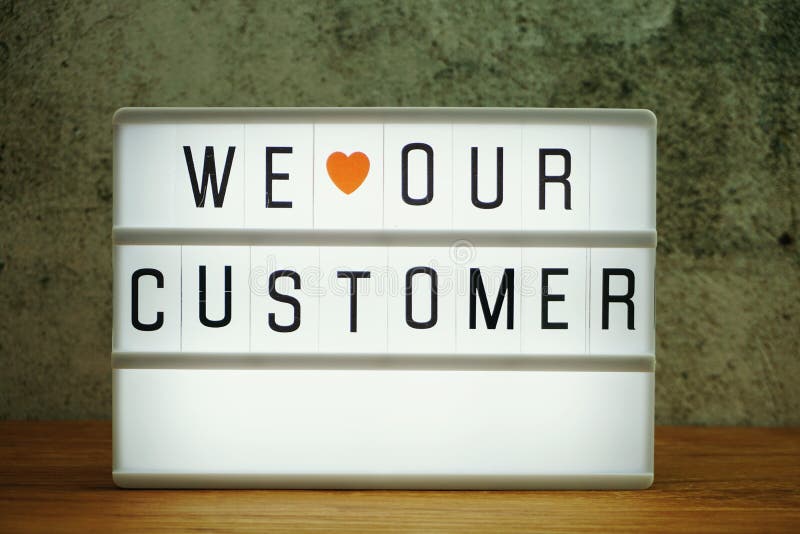 We love our customer word in light box business concept background royalty free stock image