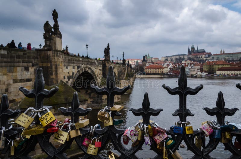 Love Padlocks on a Bridge in Prague with the Old Town in the Background