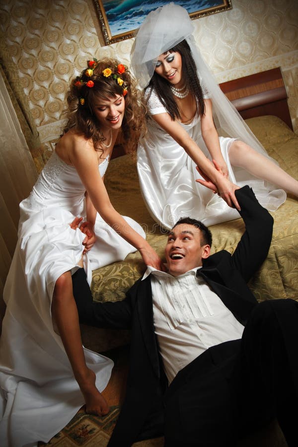 Funny scene of love triangle with two brides and one groom