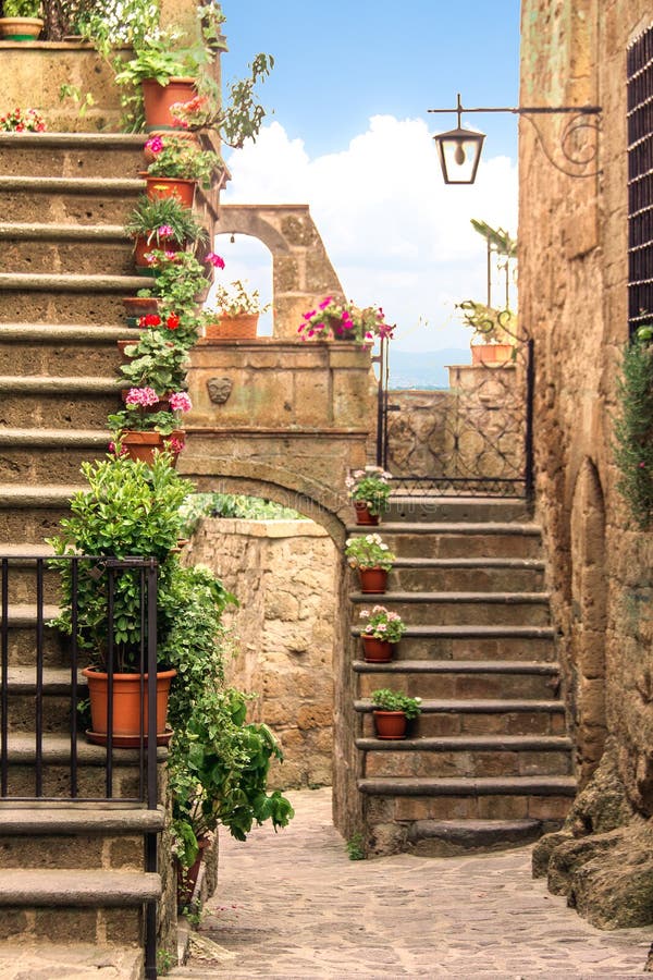 Lovely alley with flowers and stairs in a little village